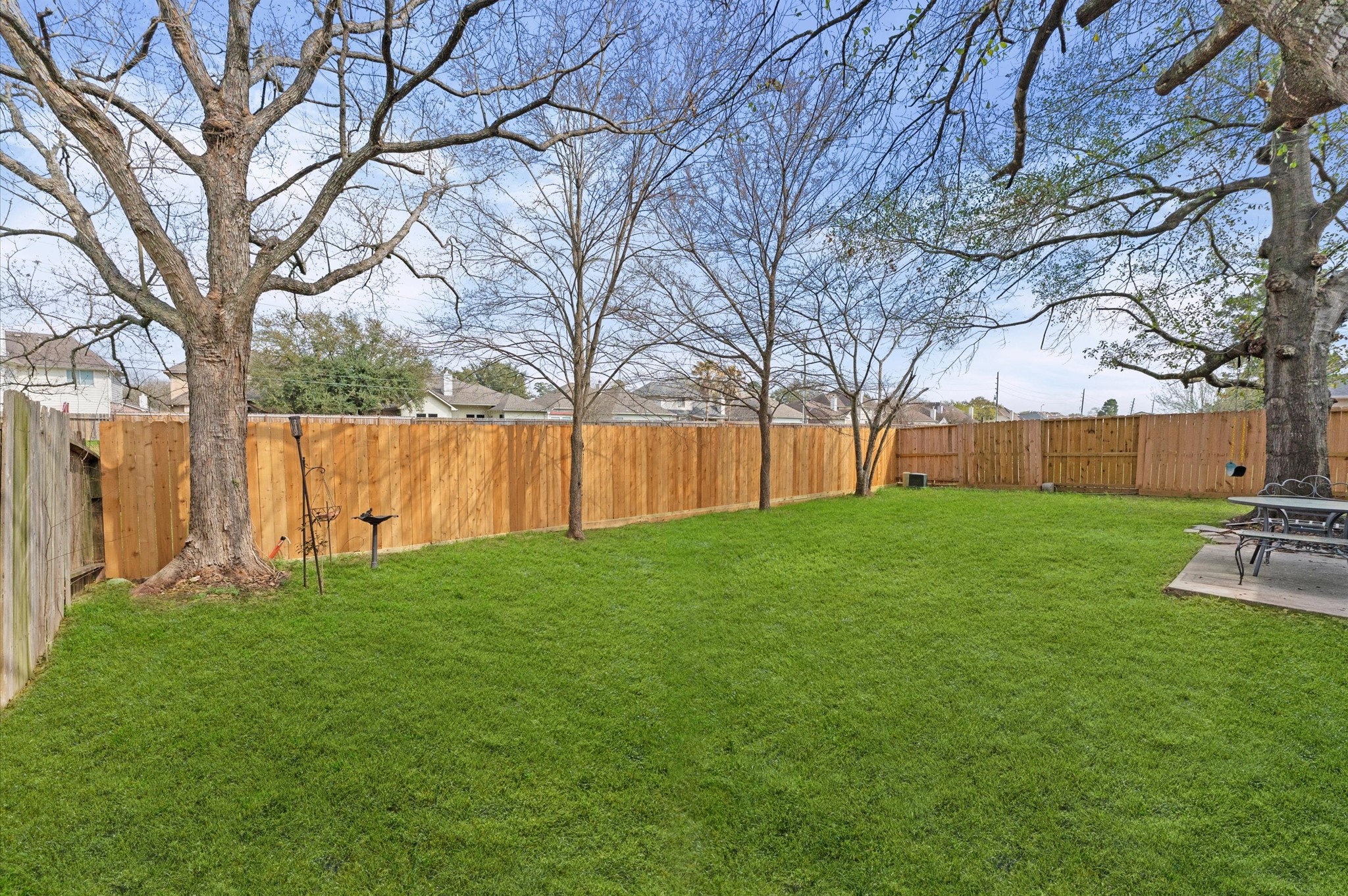 23834 Spring Dane Drive Spring, TX 77373 - Photo 17 of 19 Two sides of the fenced backyard are new and offer a nice backdrop to the many trees just waiting to bloom.