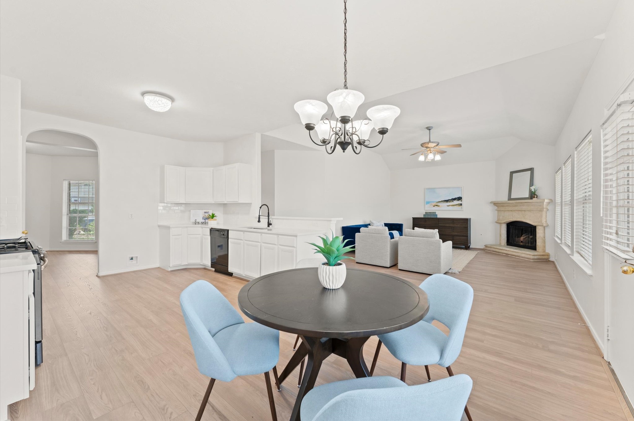 23834 Spring Dane Drive Spring, TX 77373 - Photo 4 of 19 A charming dining area opens to the kitchen and the family room. The door on the right leads to the backyard, while the arched opening on the left leads to another versatile space.