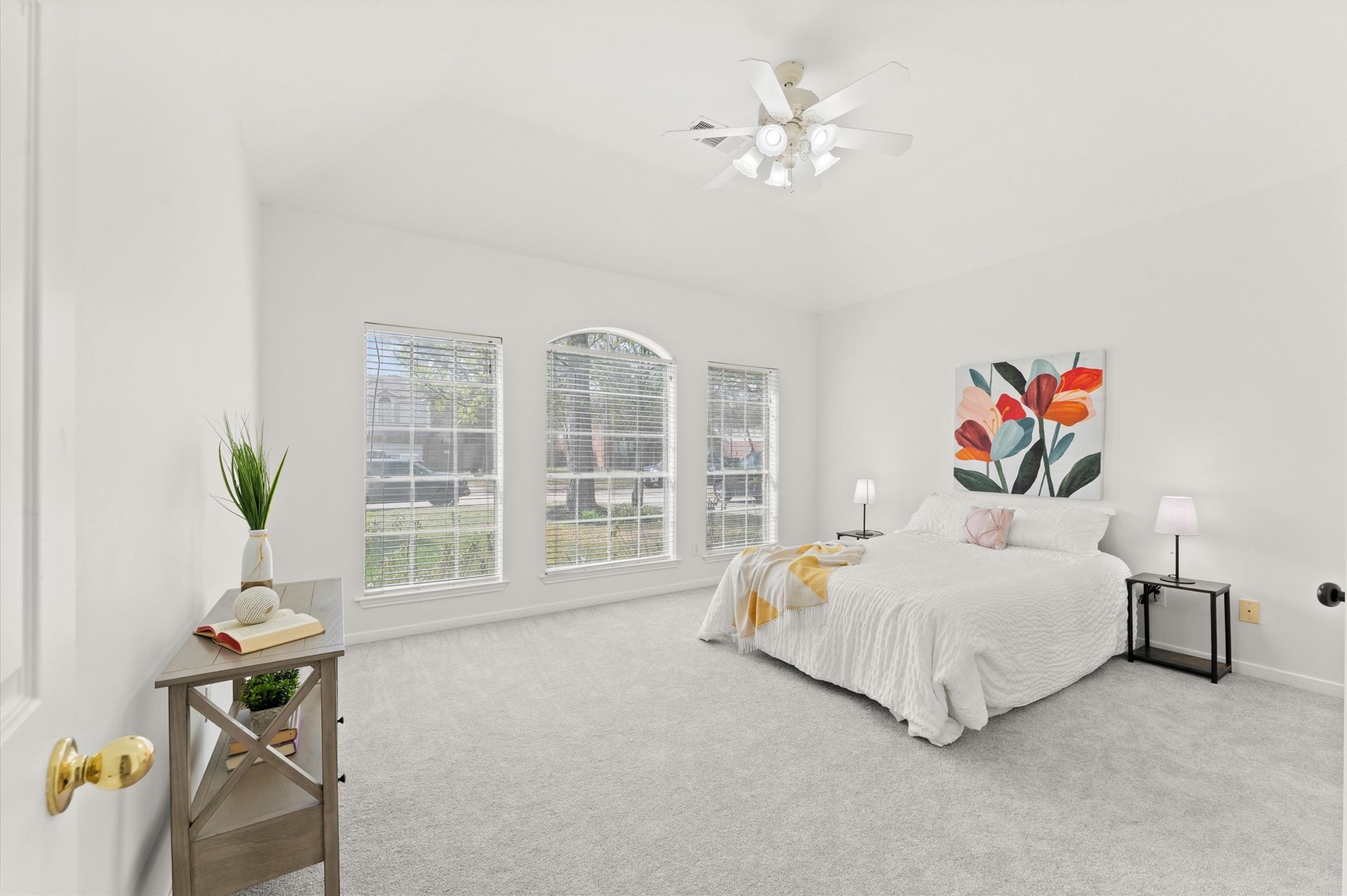 23834 Spring Dane Drive Spring, TX 77373 - Photo 9 of 19 Bright, cheery, and spacious, enjoy this incredible primary suite. A wall of windows illuminates the space where you'll find room for a king-sized bed, side tables, and a sitting area if you so choose.