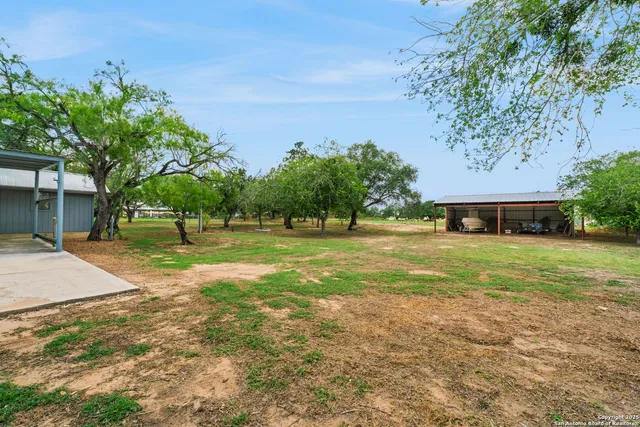 a view of a house with a big yard
