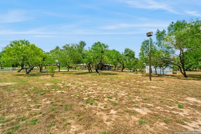a view of outdoor space with trees all around
