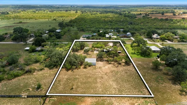 a view of a yard from a balcony