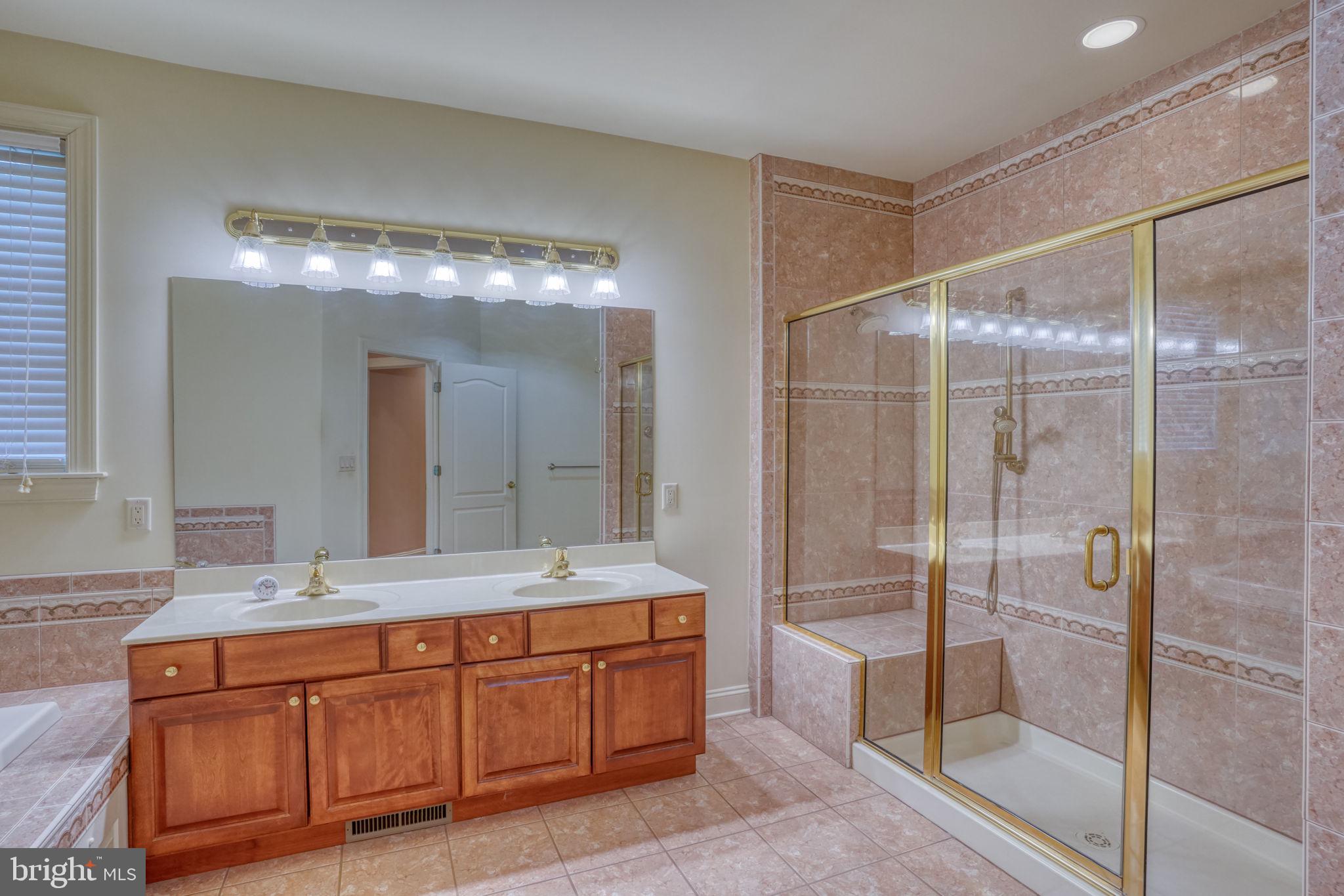 56 Coventry Court Dover, DE 19901 - Photo 25 of 53 a bathroom with a double vanity sink and a mirror