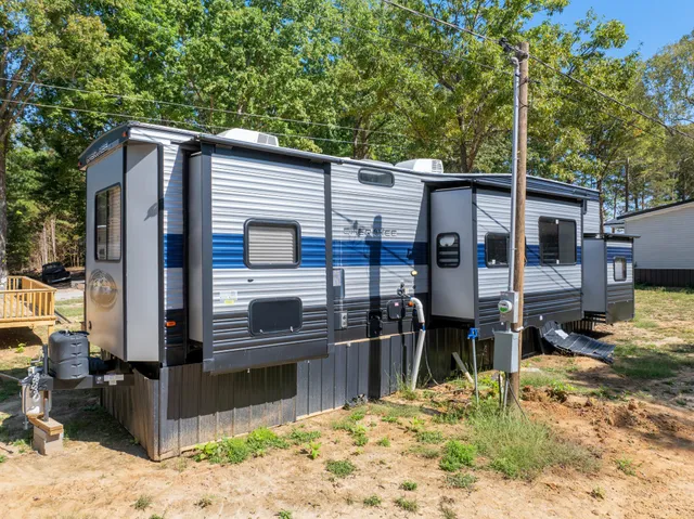 a view of a kitchen with a sink and a refrigerator