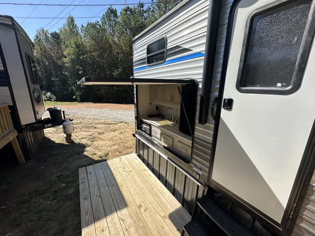 a bathroom with a granite countertop double vanity sink and a mirror