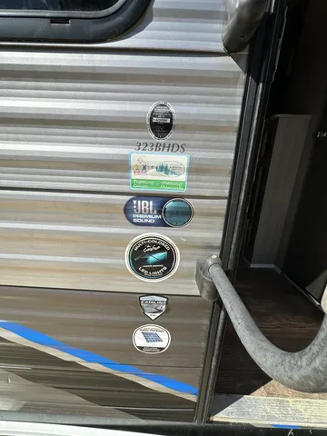 a view of a house with a wooden deck