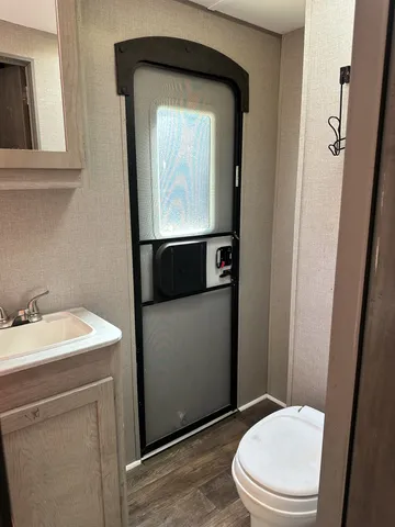 view of a hallway with wooden floor and stairs