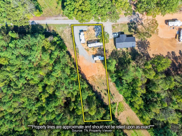 a view of a swimming pool with a yard