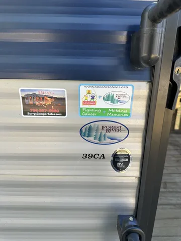 a kitchen with a sink appliances cabinets and a window