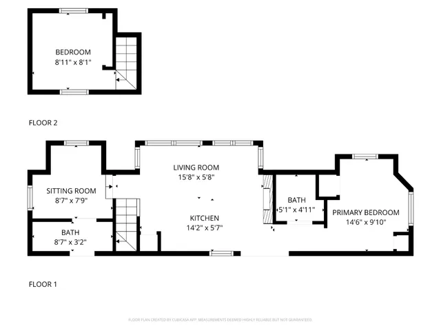 a bedroom with a bed and a flat tv screen on dresser