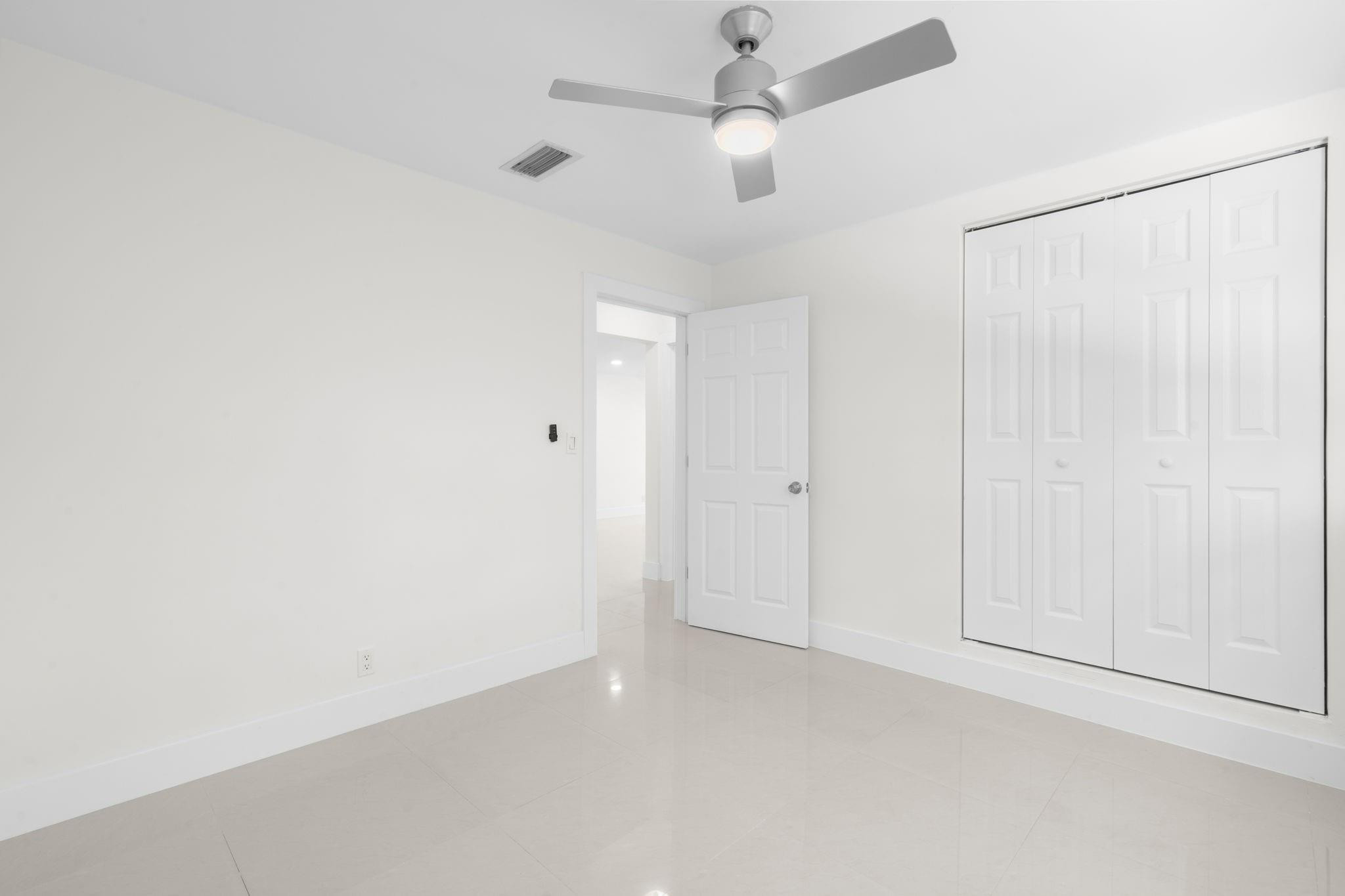 3262 Pierce Street Hollywood, FL 33021 - Photo 19 of 35 en empty room with ceiling fan