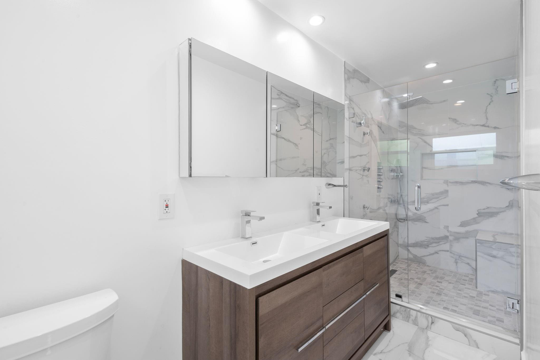 3262 Pierce Street Hollywood, FL 33021 - Photo 25 of 35 a bathroom with a sink a toilet and shower