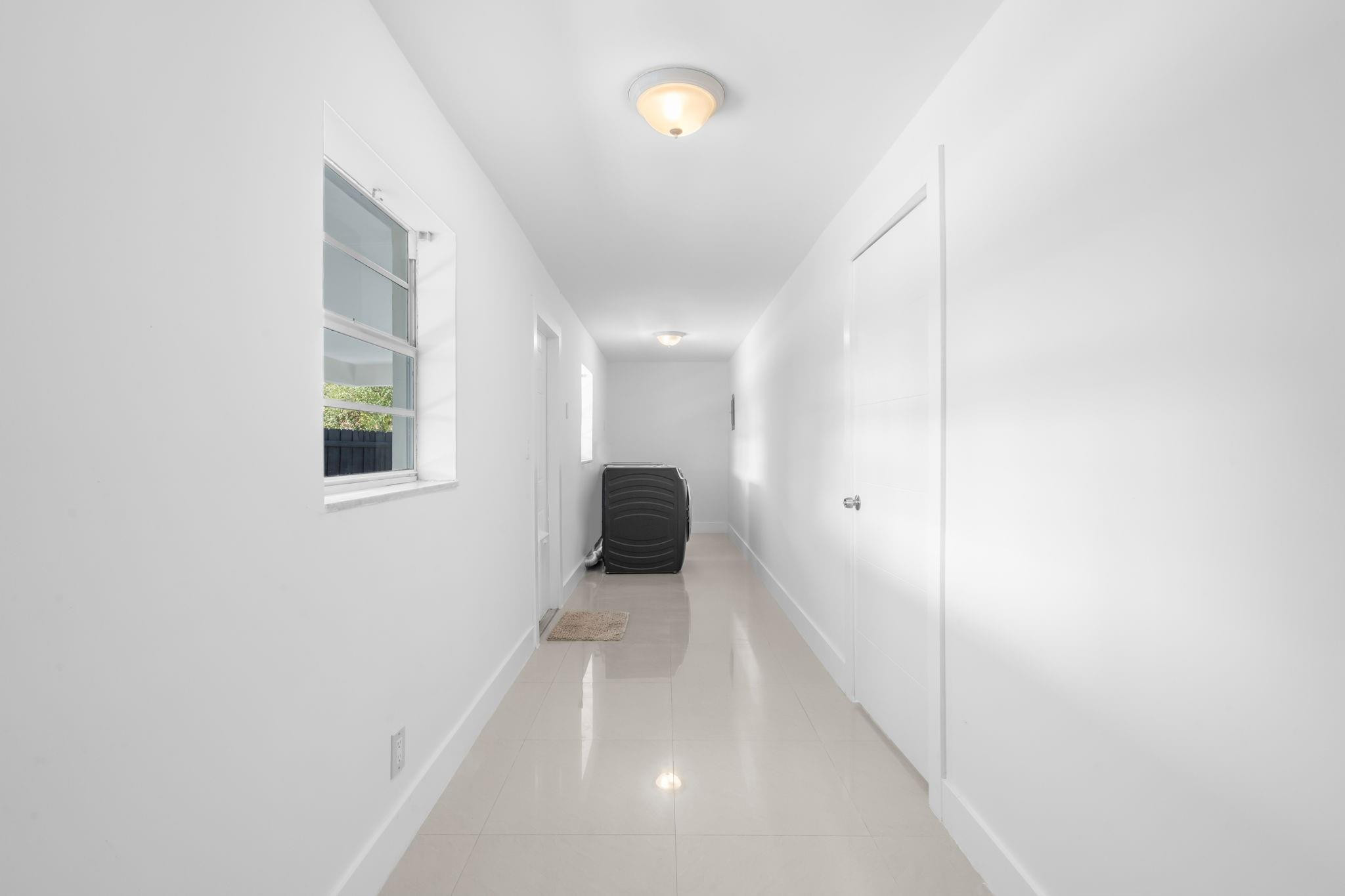 3262 Pierce Street Hollywood, FL 33021 - Photo 26 of 35 a bathroom with a sink and a mirror