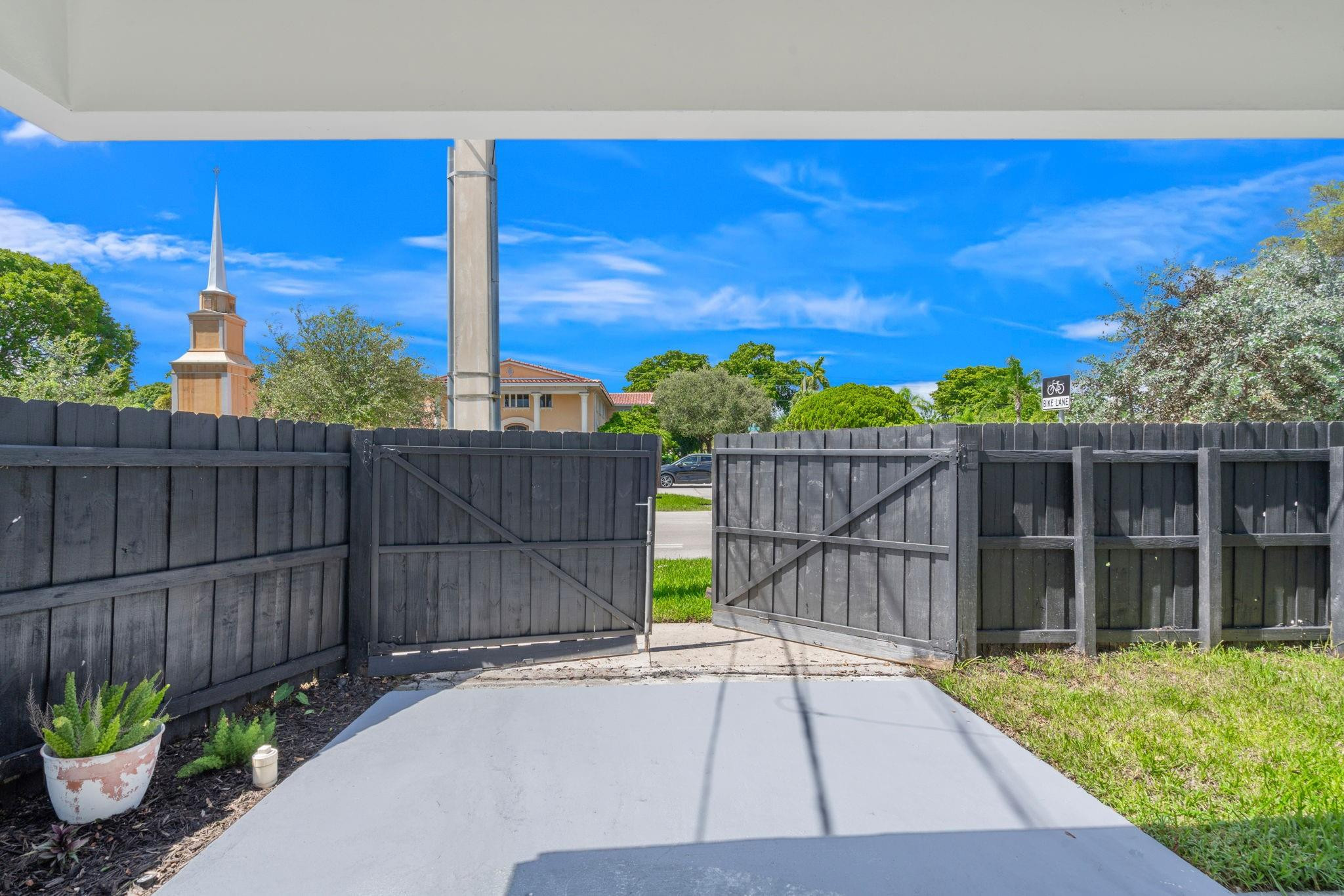 3262 Pierce Street Hollywood, FL 33021 - Photo 34 of 35 a view of a backyard with wooden fence and plants