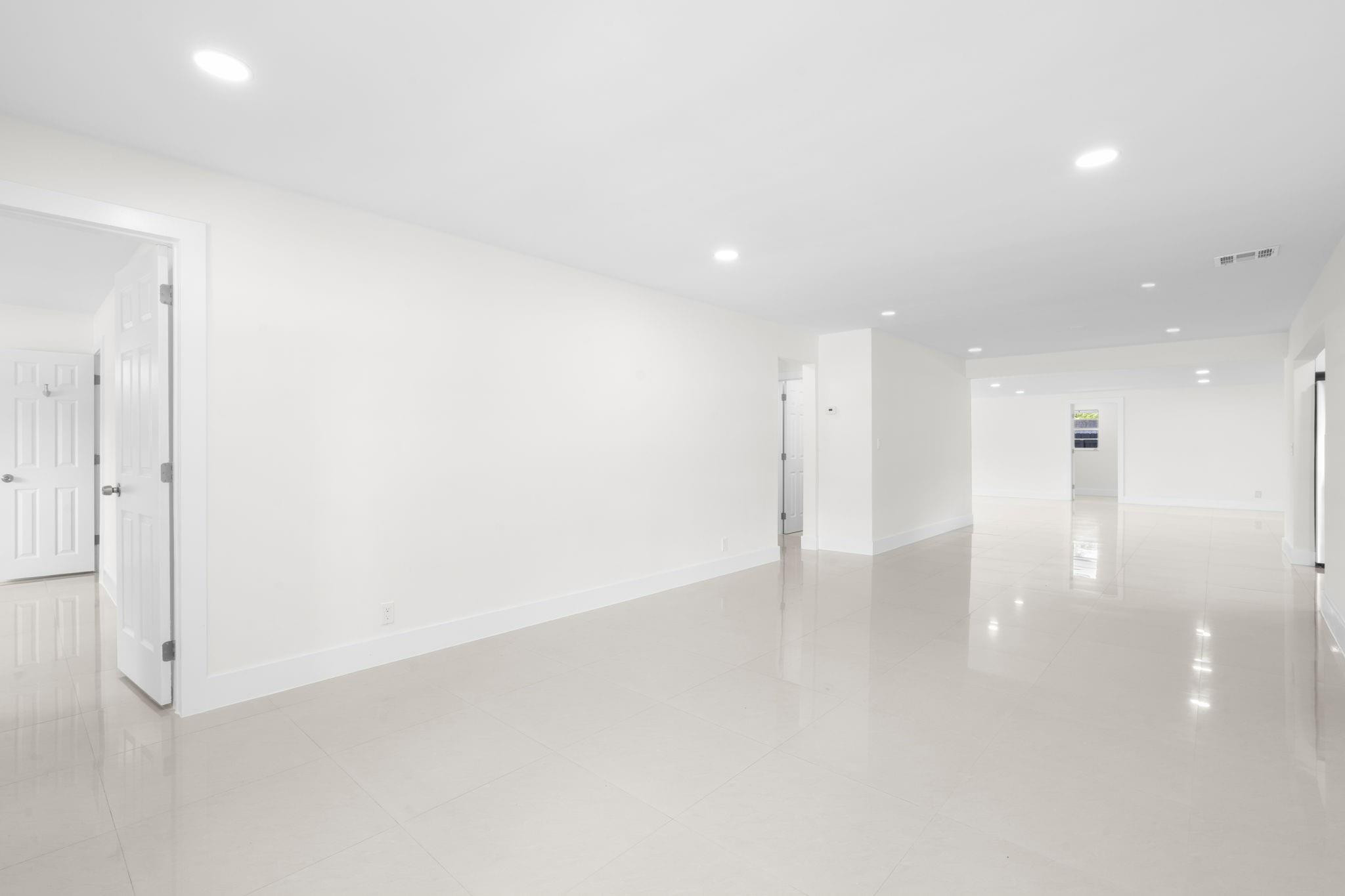 3262 Pierce Street Hollywood, FL 33021 - Photo 10 of 35 an empty room with wooden floor and windows