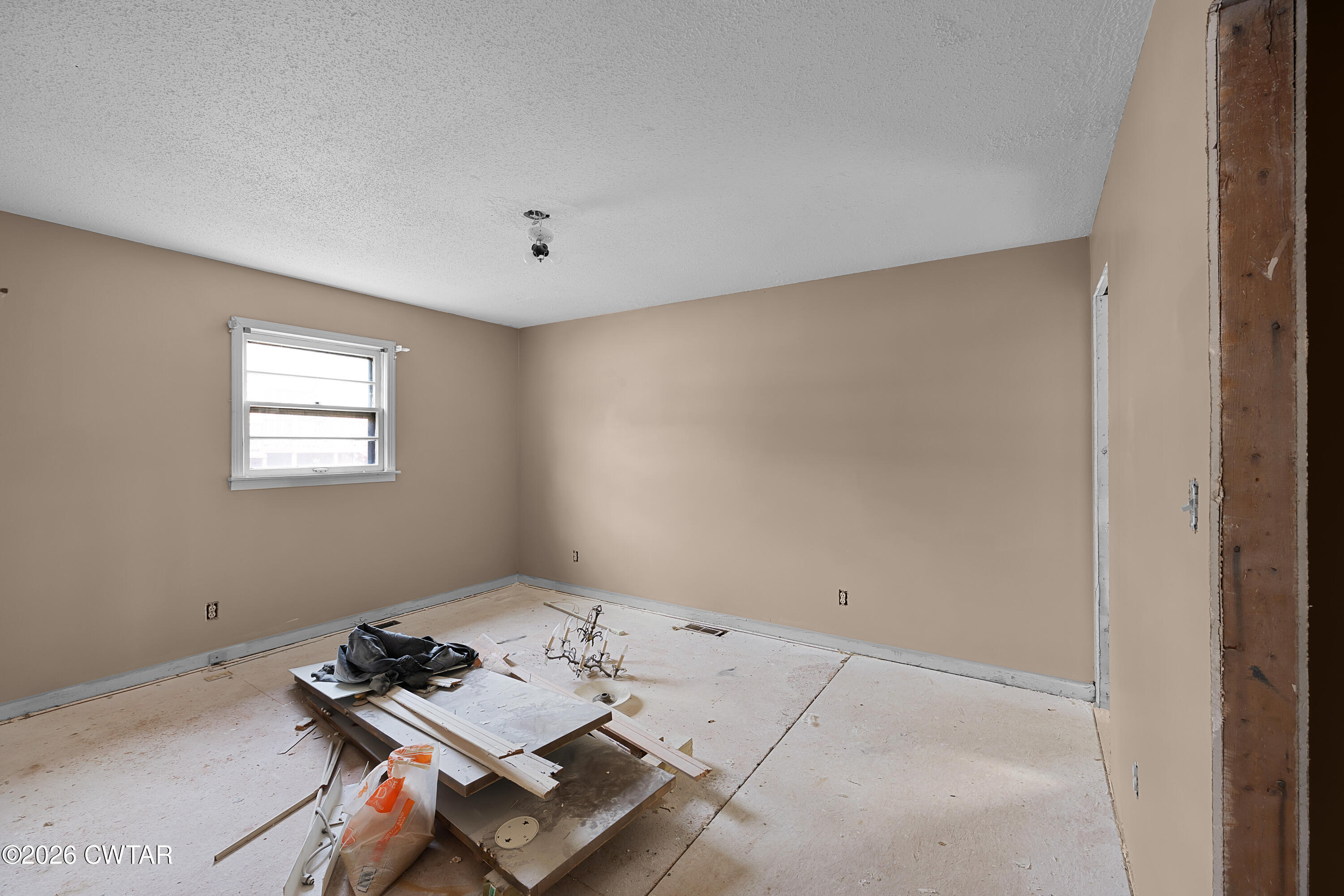88 Cherokee Drive Jackson, TN 38301 - Photo 14 of 17 a living room with hard wood floor and window