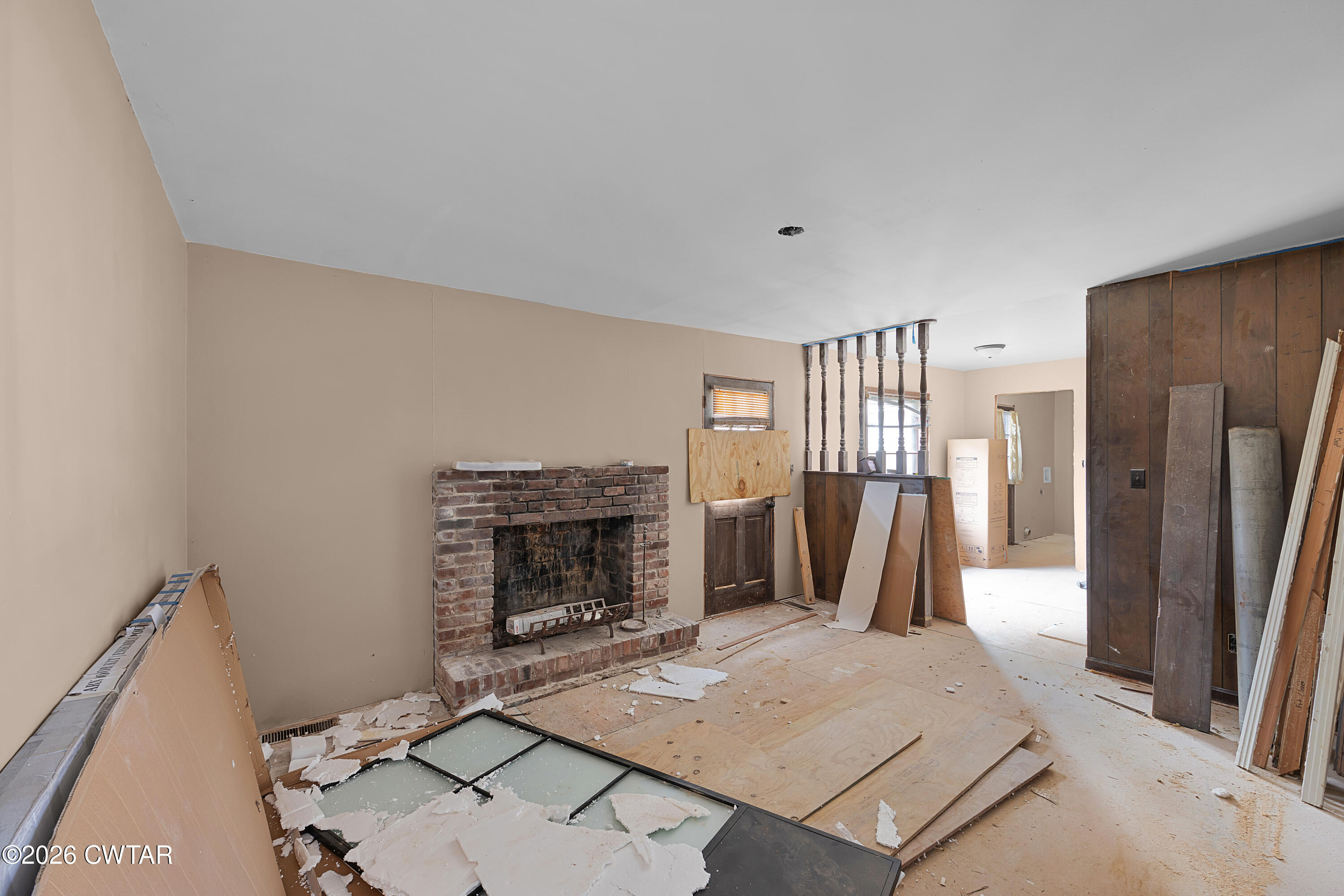 88 Cherokee Drive Jackson, TN 38301 - Photo 5 of 17 a living room with furniture a fireplace and a flat screen tv