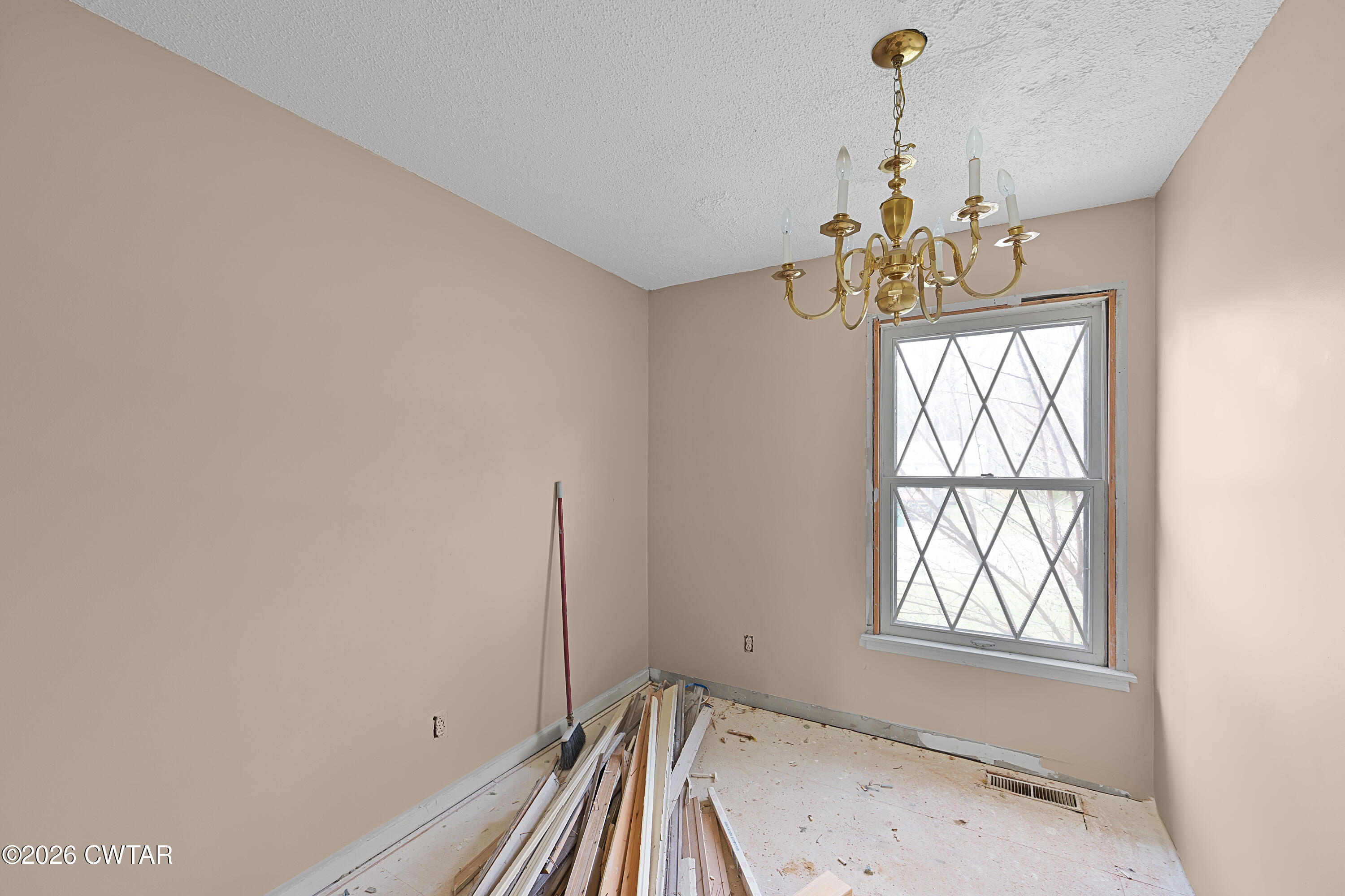 88 Cherokee Drive Jackson, TN 38301 - Photo 7 of 17 a view of a room with a window and chandelier