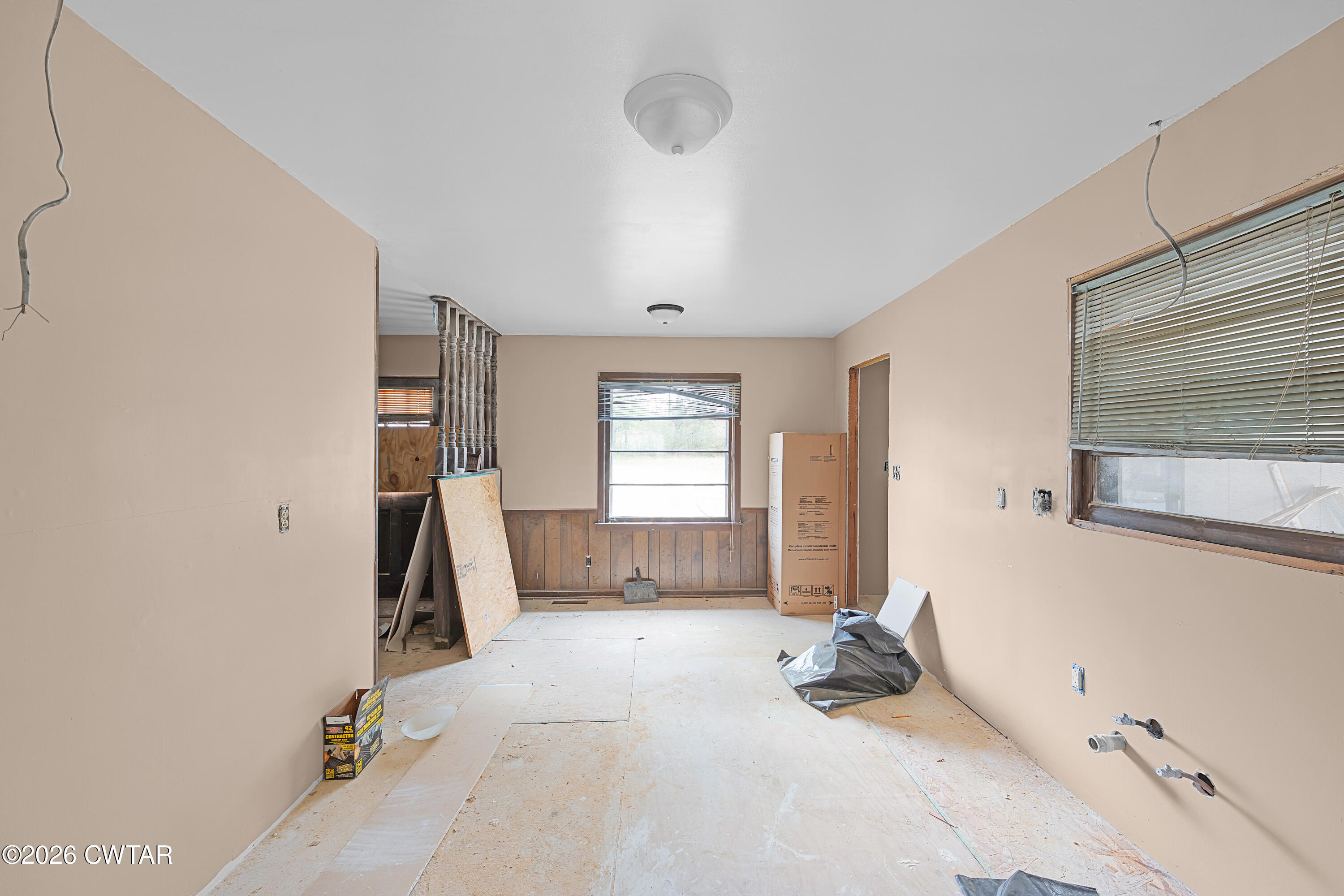 88 Cherokee Drive Jackson, TN 38301 - Photo 8 of 17 a bedroom with furniture and a large window