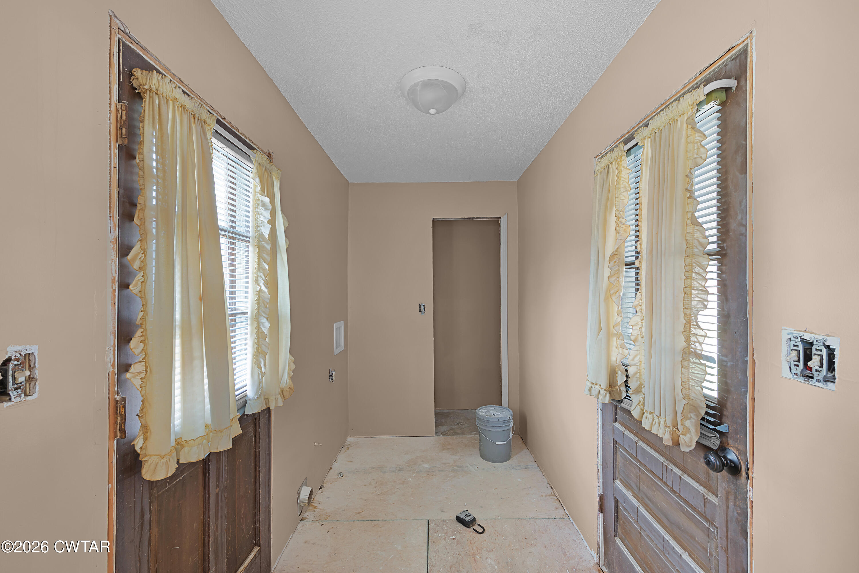 88 Cherokee Drive Jackson, TN 38301 - Photo 9 of 17 a view of a room that has a large window and front door