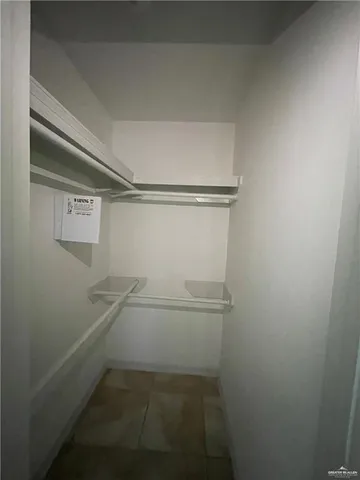 a view of an empty walk in closet
