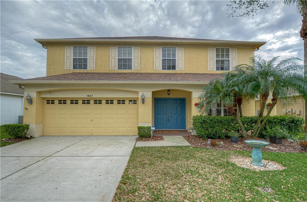 1637 Open Field Loop Brandon, FL 33510 - Photo 1 of 1 a front view of a building