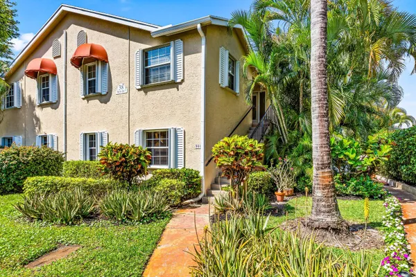 a front view of a house having yard