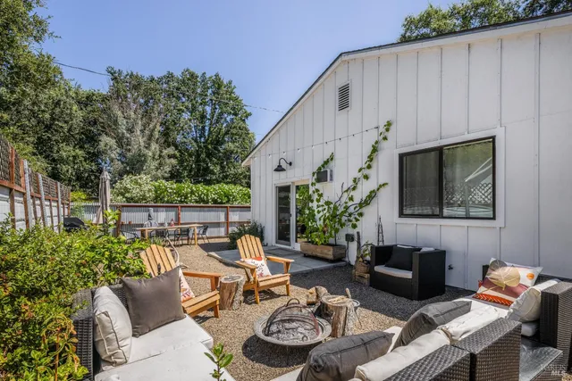 a patio with patio a couch and chairs