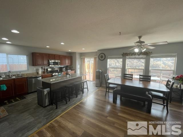 7660 Corso Street Reno, NV 89506 - Photo 4 of 21 a large kitchen with lots of counter space a sink and appliances