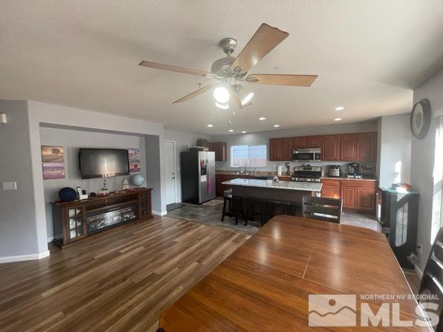 7660 Corso Street Reno, NV 89506 - Photo 5 of 21 a living room with stainless steel appliances furniture and a kitchen view