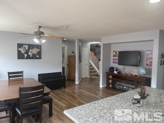 7660 Corso Street Reno, NV 89506 - Photo 6 of 21 a living room with furniture and a flat screen tv