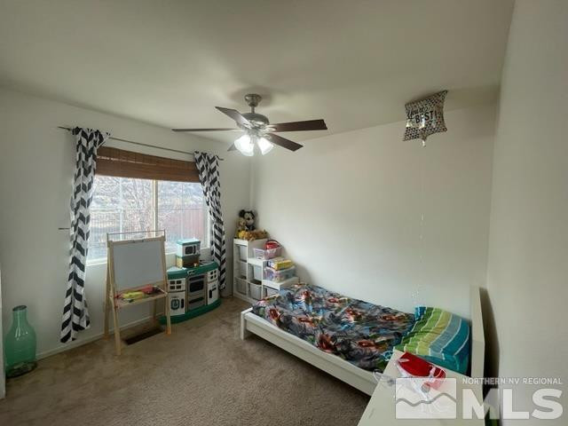 7660 Corso Street Reno, NV 89506 - Photo 8 of 21 a bedroom with bed and a window