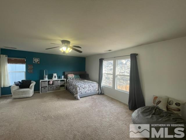 7660 Corso Street Reno, NV 89506 - Photo 10 of 21 a bedroom with furniture and window