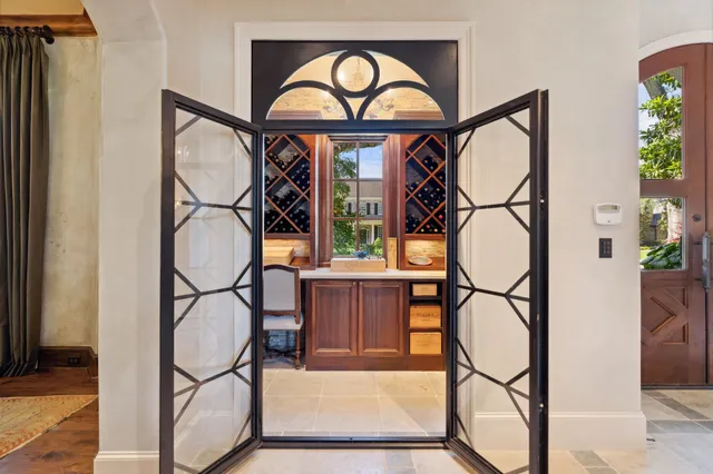 a view of staircase with a large window and wooden floor