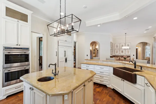 a kitchen with stainless steel appliances granite countertop a sink and stove