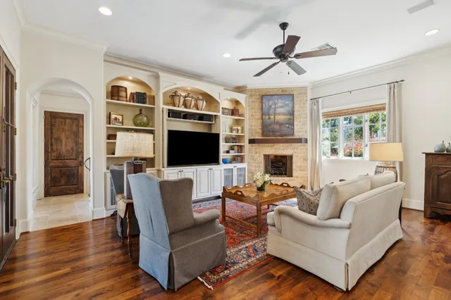 a living room with furniture fireplace and a flat screen tv