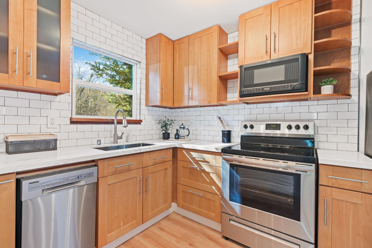7475 East Zayante Road Felton, CA 95018 - Photo 15 of 52 a kitchen with stainless steel appliances granite countertop a stove and a sink