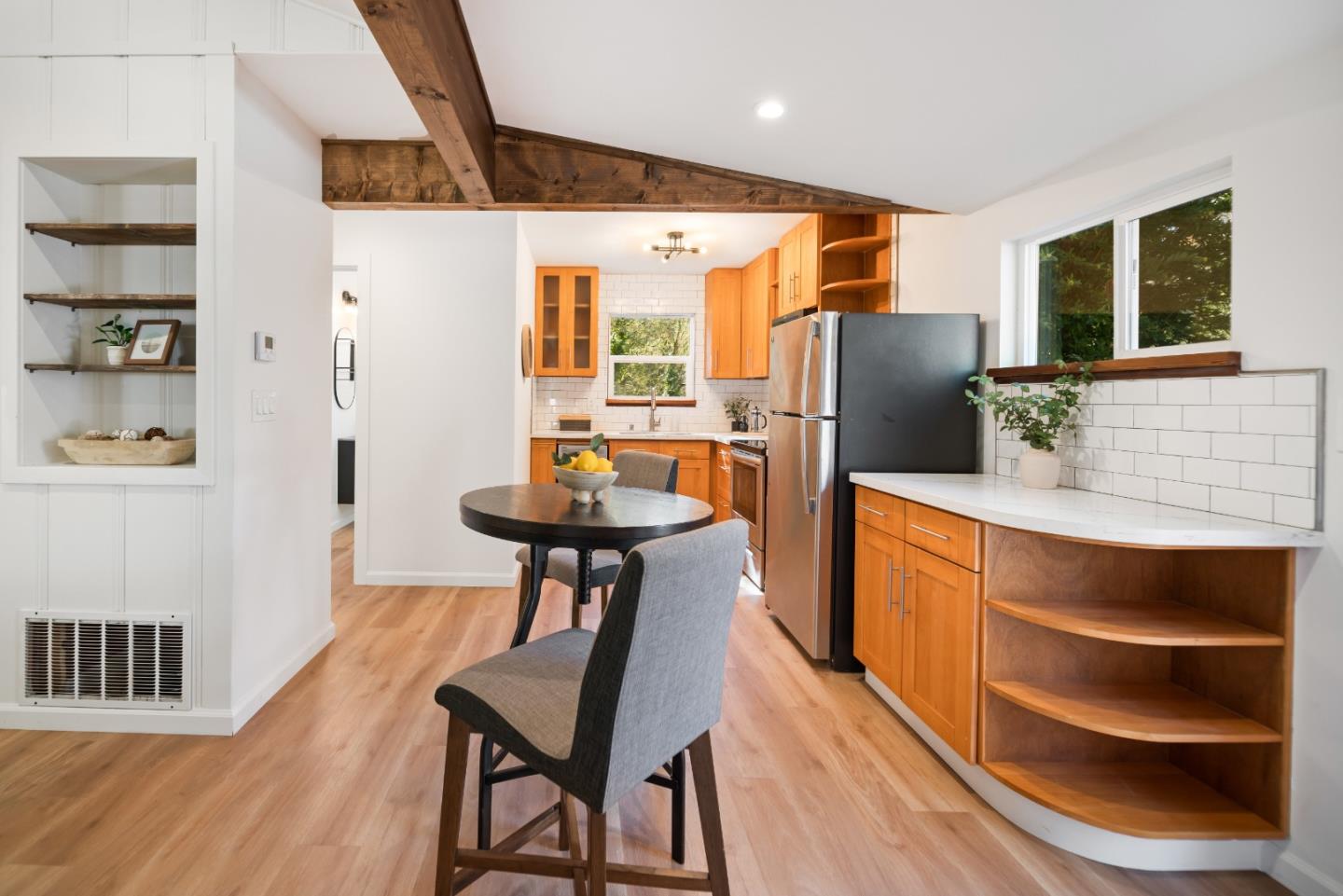 7475 East Zayante Road Felton, CA 95018 - Photo 16 of 52 a kitchen with stainless steel appliances refrigerator dining table and chairs