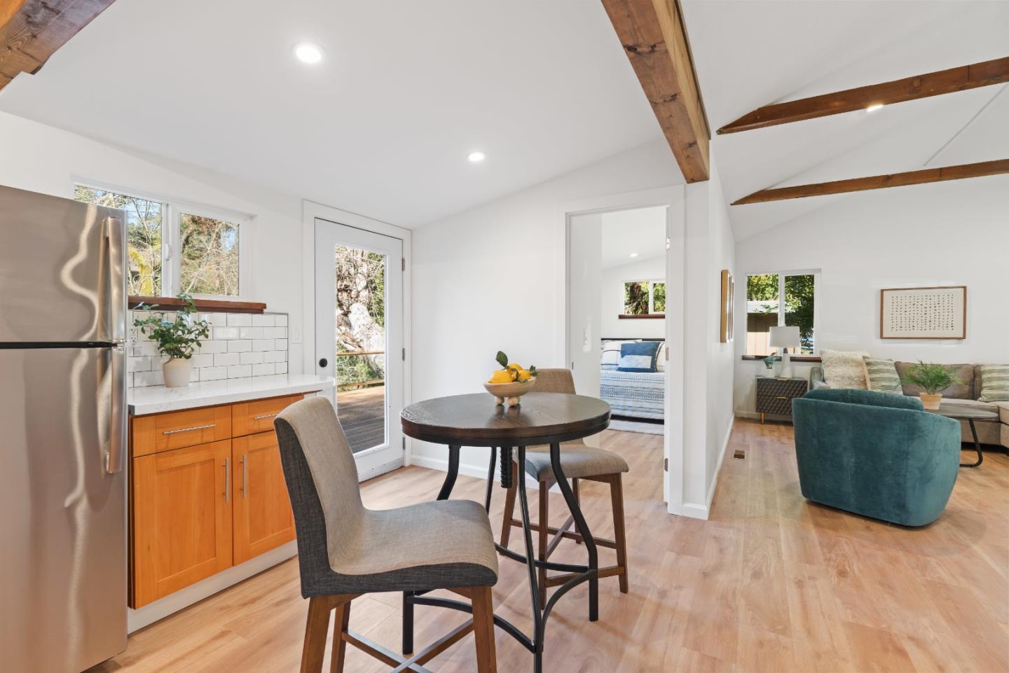 7475 East Zayante Road Felton, CA 95018 - Photo 5 of 52 a view of a dining room with furniture and wooden floor