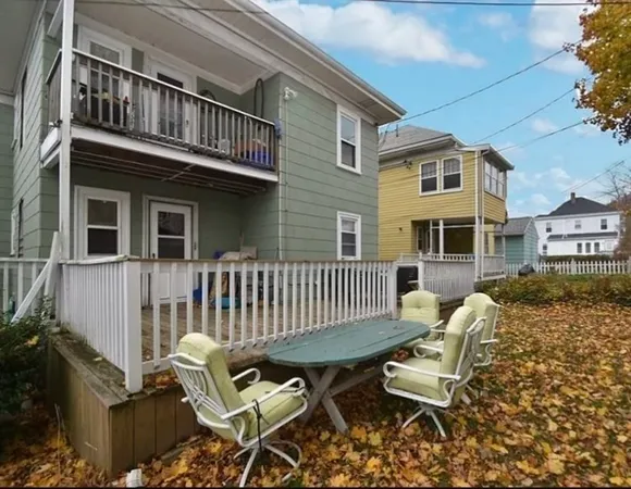 a view of a patio with a table and chairs