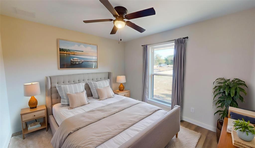 1110 Mill Run Road Athens, TX 75751 - Photo 17 of 32 a bedroom with bed and window