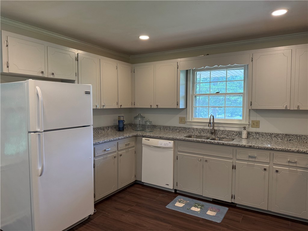 1507 East Calhoun Street Anderson, SC 29621 - Photo 5 of 18 Functional kitchen with ample cabinet space, durable countertops, and a clear view to the outdoors.