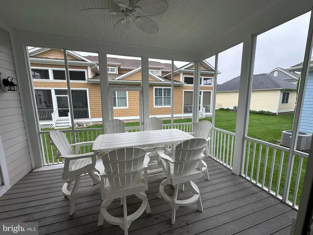 a view of a patio with table and chairs