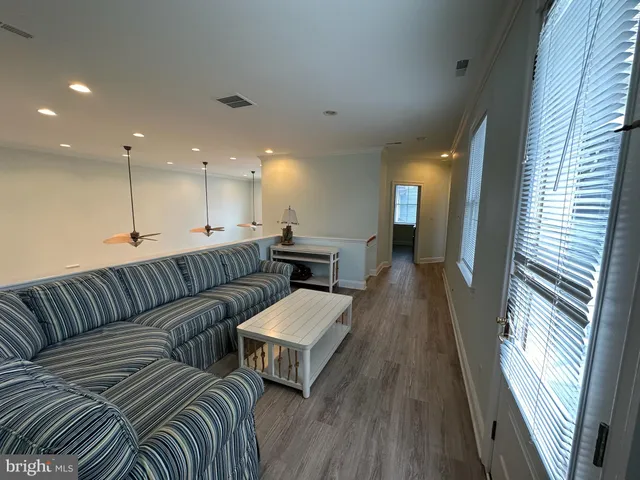 a large living room with furniture