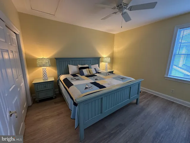 a bed room with a bed and a window