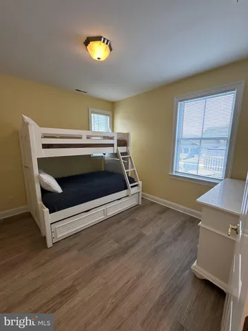 a bedroom with a bed and a desk