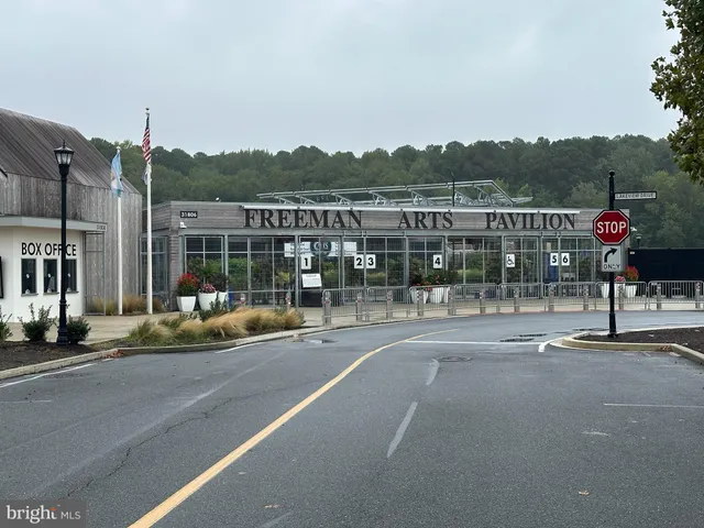 a view of a street with a building in the background
