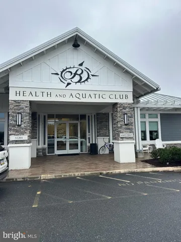a view of a building with a window and a man seat