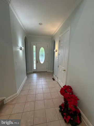a view of a room with wooden floor and window