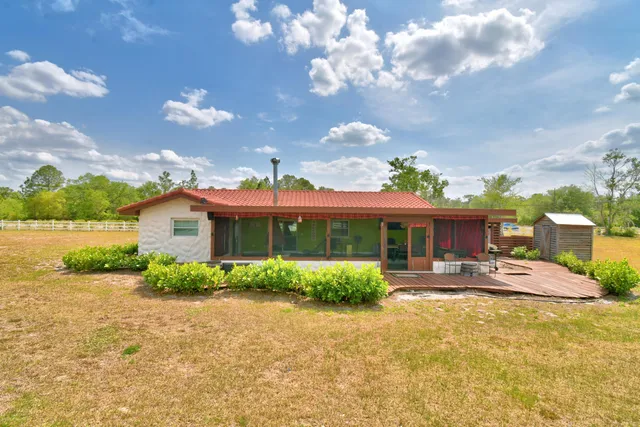 a view of a golf course with a big yard